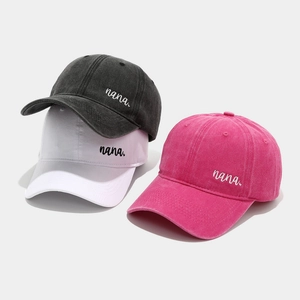 Three colors of cotton baseball caps with nana embroidery in grey white and pink