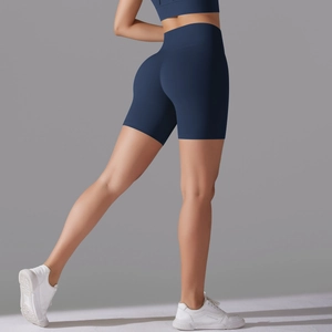 Side view of navy blue high-waisted seamless yoga shorts showing squat-proof compression fit