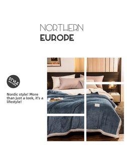 Detail of three-layer padded milk velvet blanket with wavy edges and quilted stripe texture