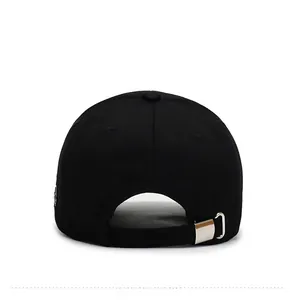 Close-up of black baseball cap back with adjustable silver metal buckle and cotton texture