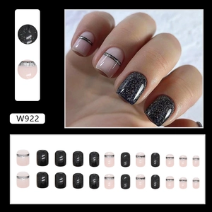 Detail view of W922 press-on nails featuring black glitter and nude pink stripe designs