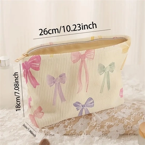 Beige corduroy makeup bag with colorful bow prints and dimensions 26x18x5cm