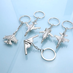 Five-piece silver zinc alloy fighter jet keychain set featuring classic aircraft models