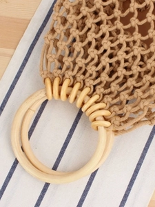 Handmade camel woven mesh bag with round wooden handles for summer beach vacations