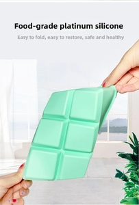 Flexible food-grade mint green silicone ice tray showing its foldable and soft texture