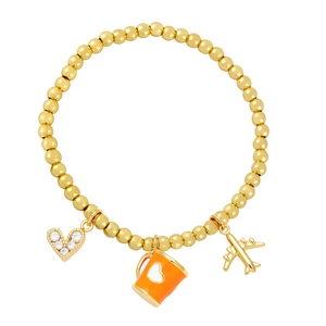 Detail of beaded bracelet with gold airplane, orange coffee cup and heart charms