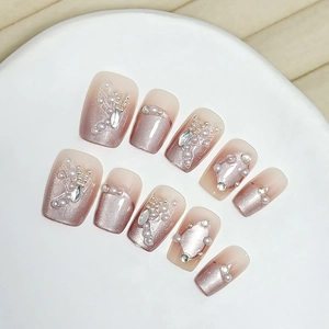 Handmade nude pink cat eye press-on nails with 3D butterflies and white pearls