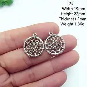 Detail view of round hollow metal charm with size dimensions 19mm by 22mm for DIY jewelry