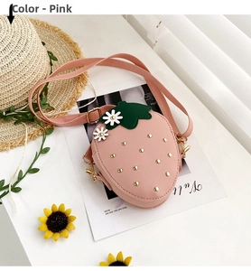 Detailed view of kids strawberry crossbody bag in pink with daisy floral accents
