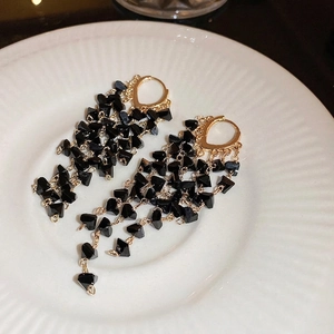 Elegant gold drop earrings with black crystal beads and long tassel design for women