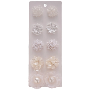 Set of 5 minimalist white flower and pearl earrings on a display card for daily wear