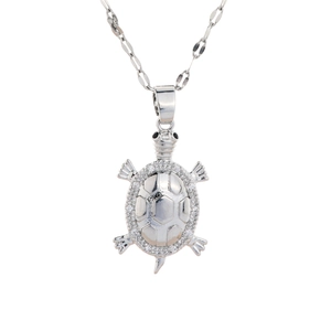 Silver turtle pendant necklace with sparkling cubic zirconia stones on white background