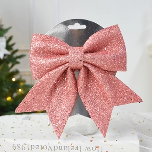Close-up of glittery pink bow decoration with dense sequins for Christmas tree decor