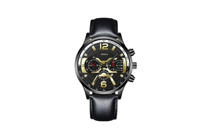 Close-up of black quartz watch face with golden hands and chronograph sub-dials