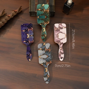 Set of four marble pattern air cushion hairbrushes in purple, green, pink and blue