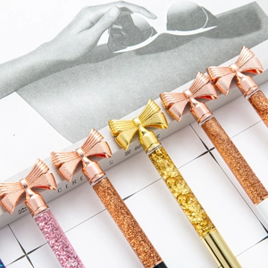 Creative metal ballpoint pens with liquid glitter and golden bow decoration