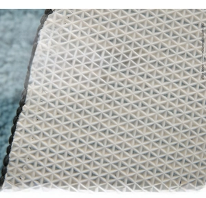Close-up of TPR non-slip backing with pyramid texture for bathroom floor mat safety