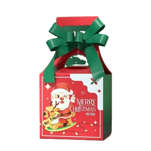 Christmas gift box in festive red with green ribbon bow and Santa Claus illustration