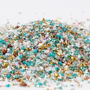 Close-up of 2-8mm mixed colorful glass gravel and metal beads for DIY craft projects