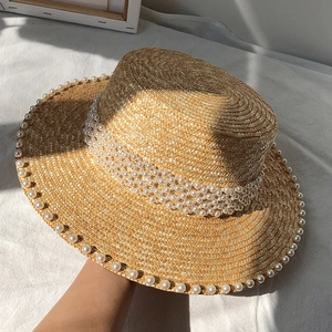 Flat top straw hat with pearl trim and wood color finish for elegant sun protection