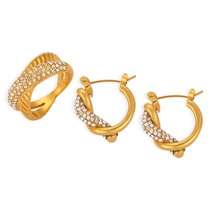 Luxe gold-plated jewelry set with twisted pavé diamond ring and matching knot earrings
