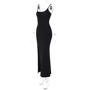 Detailed side view of a slim fit black maxi dress featuring a sexy side slit and bodycon cut