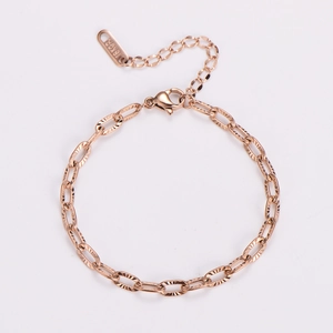Detail of rose gold embossed link bracelet with 18KGP tag and lobster clasp closure