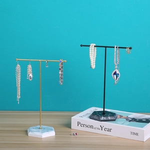 Modern T-shaped metal jewelry stand with marble base for necklace and earring display