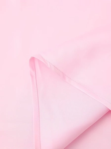 Detail of pink satin fabric showing smooth texture and high-quality stitching craftsmanship