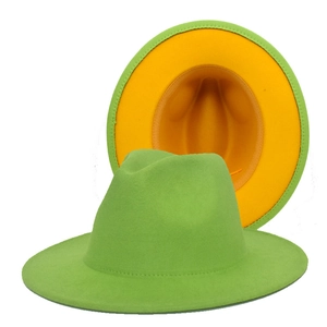 Detail showing the green wool felt fedora with a contrasting yellow interior under-brim