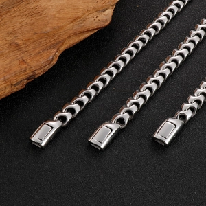 Close-up of industrial hip hop silver stainless steel Cuban link chain texture