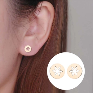 Rose gold hollow snowflake stud earrings with geometric circle design for women