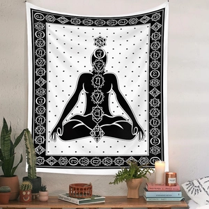 Macro detail of Bohemian tapestry showing chakra symbols and meditation silhouette