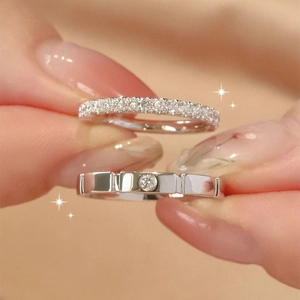 Minimalist silver couple ring set featuring pave diamonds and vertical grooved design