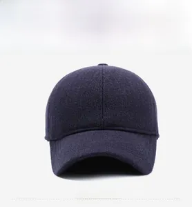 Front view of a dark thick wool baseball cap with a warm ear protection design