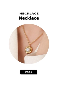 Detail of 18K gold plated choker necklace with woven texture pendant and white pearl inlay
