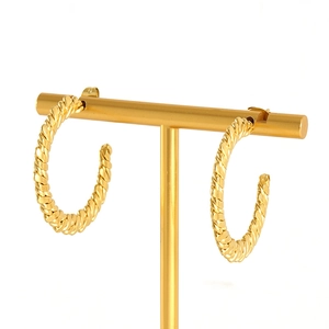 French vintage 18K gold plated stainless steel twisted hoop earrings on display stand