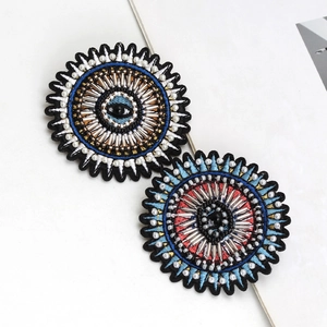 Handmade Evil Eye beaded brooches in blue and red embroidery with sparkling crystals