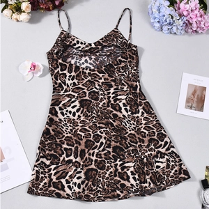 Detailed flat lay of leopard print mini dress with thin straps and V-neckline texture