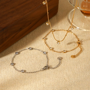 Elegant gold and silver stainless steel tassel necklaces with zircon stones on fabric
