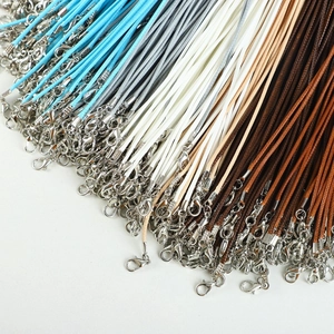 Close-up of braided wax necklace cords in multiple colors with metal lobster clasps