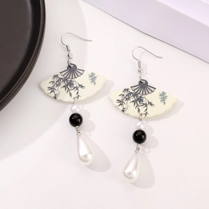 Detailed view of Chinese style fan-shaped earrings with ink bamboo pattern and pearls