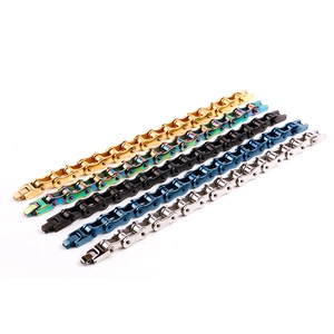 Detail shot of bicycle chain bracelets in gold, multicolor, black, blue, and silver steel