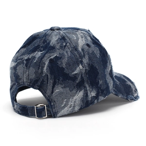 Distressed blue denim baseball cap with vintage frayed edges and metal adjustment buckle