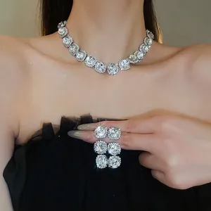Elegant silver rhodium plated round zircon necklace and earrings set on female model
