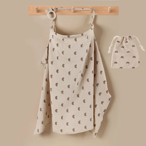 Muslin cotton nursing cover and drawstring storage bag with neutral rainbow print pattern