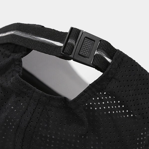 Detail of adjustable snapback buckle and breathable mesh on a black outdoor baseball cap