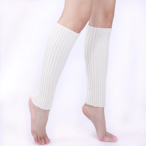 Detailed view of white ribbed knit leg warmers showing soft vertical texture and elasticity