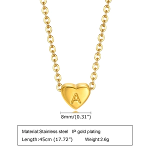 Macro detail of gold plated heart pendant with letter A on 45cm stainless steel chain