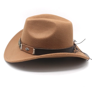 Close-up of brown felt cowboy hat with stitched leather band and metal diamond studs